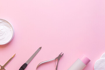 Obraz na płótnie Canvas Set of manicure and pedicure tools on pink background