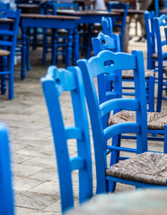Blue chairs. Dining seaside in Sicily 