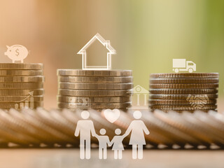 Investment, financial, money saving, and loan concept. Close-up stack coins with icons of family who save the money for investment or purchase new house or home and car. 
