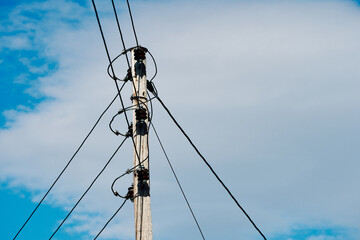 wooden wire pole in the sky