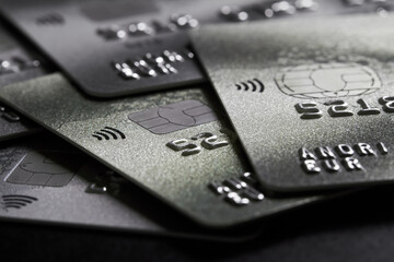 Close-up of a group of bank credit cards on dark background