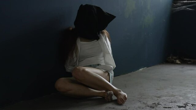 Young Woman Was Kidnapped and Imprisoned in Old Building. concept of violence and criminal