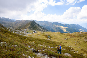 Fototapeta premium San Marco Pass, Averara Province of Bergamo, Italy - 08 16 2022: A good day on San Marco Pass in Italy