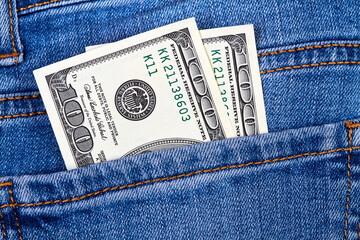 Hundred dollar bills in jeans pocket