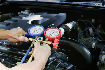 Fototapeta premium Car air conditioner check service, leak detection, fill refrigerant.