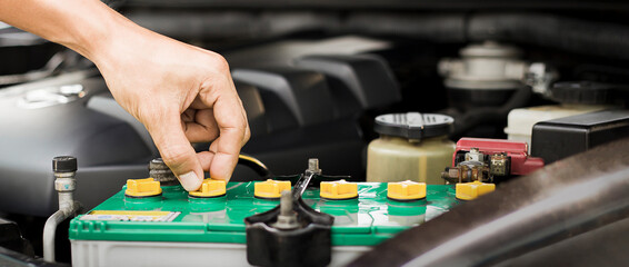 Technicians inspect the car's electrical system.