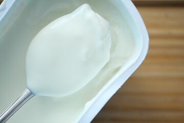 Fototapeta na wymiar fresh yogurt in a bowl on table 