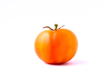 Fresh natural orange tomatoes on white color background