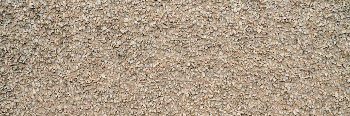 urban texture and background - building facade finished with fine gravel, wide web banner