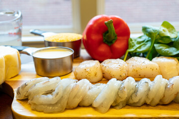 Mise en Place on a Wooden Cutting Board - Shrimp, Scallops, Tomatoes, Spinach, Red Bell Pepper, Fontina Cheese, and Grits 