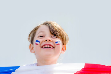 Beautiful little girl with a France flag and her tricolor makeup - 524878814