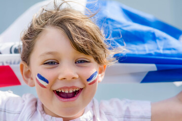 Beautiful little girl who supports France with her flag  - 524879094