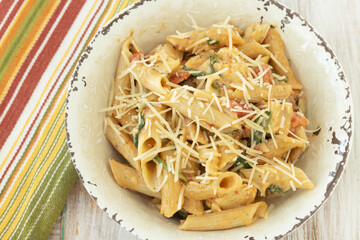 Close Up Gluten Free Penne Pasta With Cheese In Rustic Bowl