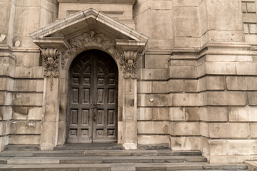 Fototapeta na wymiar Detail historic building canopy rectangular facade door