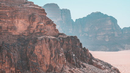 Tourist observes the panorama in the desert Wadi Rum, Jordan