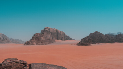 Fototapeta na wymiar Tourist observes the panorama in the desert Wadi Rum, Jordan