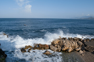 waves crashing on rocks