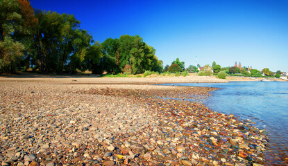 Dried up river bed, beach without water. Low water level of the Rhein dry river landscape, photo On...