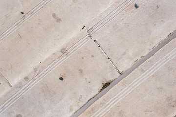 Old weathered marble block staircase, top view, stairs with stains and scratches, steps pattern and texture, stone textured surface.
