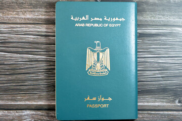 Egyptian passport isolated on wooden background, Arab republic of Egypt's passport with the...