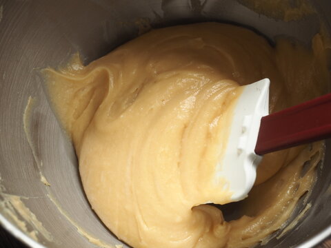 mixing choux pastry paste with rubber spatula