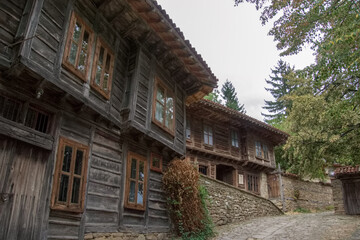 Street with traditional wooden houses at the village of Zheravna, Bulgaria