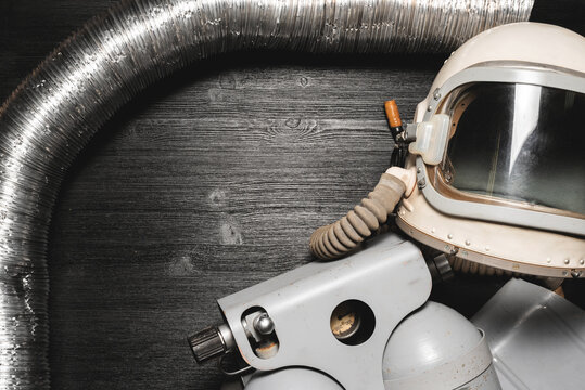 Space concept background. Astronaut helmet and oxygen ballon equipment on the table flat lay background with copy space.
