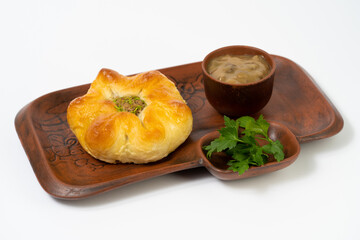 Ukrainian traditional bun with meat and sauce