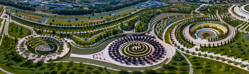 three large flower beds in a city park in the northeast of Krasnodar (South of Russia) - aerial panorama on a sunny day - obrazy, fototapety, plakaty