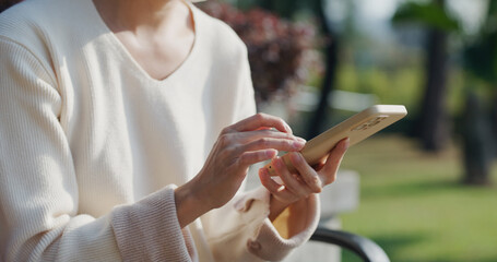 Woman use smart phone at outdoor