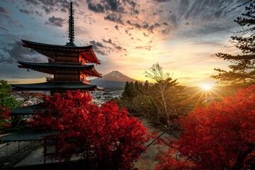 Fototapeta na wymiar Red Pagoda with Mt Fuji on the background,Mt. Fuji with red pagoda in autumn, Fujiyoshida, Japan,Chureito Pagoda.