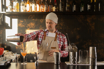 Barman at work, preparing cocktails. concept about service and beverages.