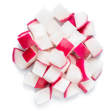 top view of pile vegetables roots of radish diced isolated on white background