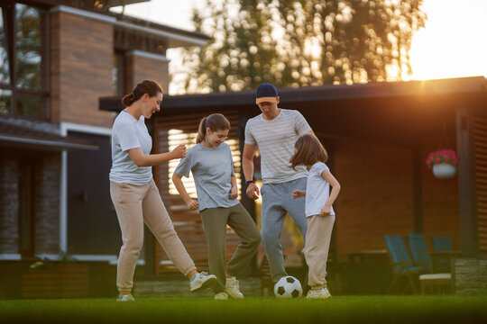 Happy Family Playing Soccer