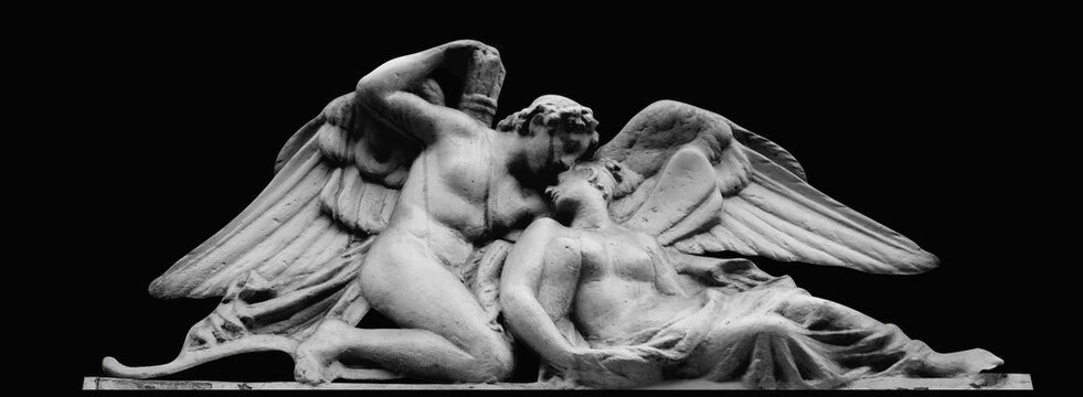 Psyche revived by Cupid's kiss. Isolated on black background. Black and white image. Horizontal image.