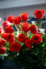 Red roses in a flower shop.Flowers in a flower shop. Concept flower store and delivery.