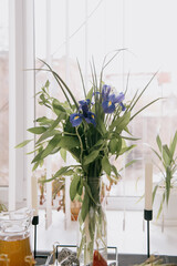 Blurred image of bouquet of fresh tulips in flower shop. Spring floral tulip bunch.
