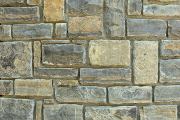 The texture of the stone wall. Stone wall as background or texture. Part of stone wall for background or texture