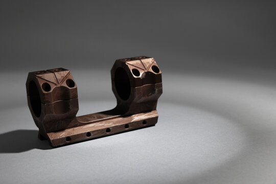 Quick disconnect sniper cantilever scope mount on grey background. Space for text