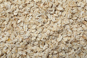 Pile of oatmeal as background, top view