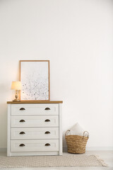 Stylish chest of drawers in living room interior