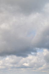 Naklejka na ściany i meble White cumulus clouds in the blue sky. Bright beautiful sky, copy space background