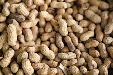 Heap of delicious peanuts as background, closeup view