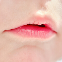 Fototapeta premium Close-up lips baby age one year, child mouth macro photo