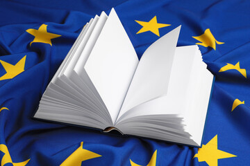 Open blank book on flag of European Union
