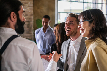Co-workers arguing standing up to improve the economic results of the company