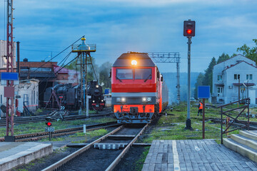 Passenger train approaches to the platform.