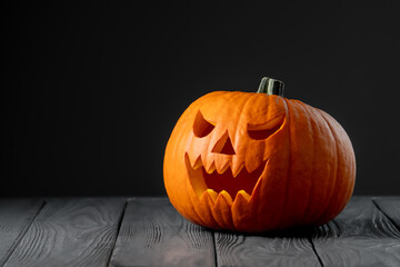 Jack-o-lantern in smoke on black