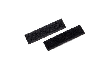 Two pieces of black velcro, photographed diagonally on a white background.