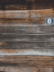 old wood panel, vintage wood panel with old stained wood planks with some worm holes and a number...